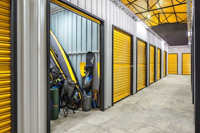 Corridor,Of,Self,Storage,Unit,With,Yellow,Doors.,Rental,Storage